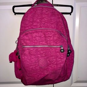 Kipling large pink laptop backpack.